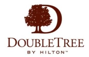 Logo of DoubleTree by Hilton featuring a stylized tree inside a large "D" above the text "DOUBLE TREE BY HILTON" in brown lettering.